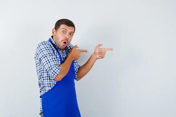 Professional garage door repair technician working on residential garage door in Stamford, CT